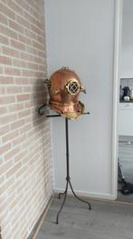 .::Bronze duikerhelm, Ophalen