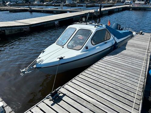 Knappe consoleboot met 70 pk + geremde trailer., Watersport en Boten, Vis- en Consoleboten, Zo goed als nieuw, 70 pk of meer, 3 tot 6 meter