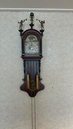 Nederlanders wandklok, Ophalen