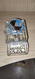 Glazen inktpot met afbeelding, Ophalen