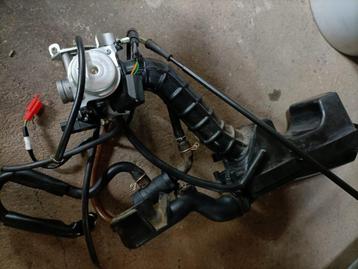 Carburateur E4 Sym ,Kappenset Orbit 2 ,SpanningregelaarE5  beschikbaar voor biedingen