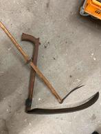 Oude zeis met houten handvat, Ophalen