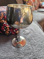 verzilverde drinkbeker, Ophalen