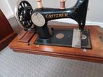 Antieke gritzner naaimachine, Ophalen