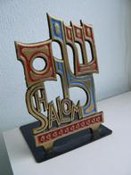 boekensteun uit Israël, brons, Ophalen