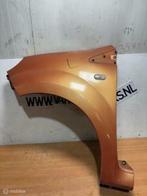 Voorscherm links oranje Renault Twingo II ('07-'14), Gebruikt, Renault, Ophalen of Verzenden, Renault