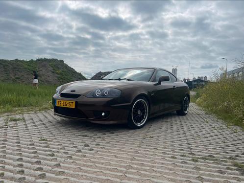 UNIEK! Hyundai Coupé 2.7 V6 AUT 2003 Grijs, Auto's, Hyundai, Particulier, Coupé, Airbags, Airconditioning, Bluetooth, Centrale vergrendeling