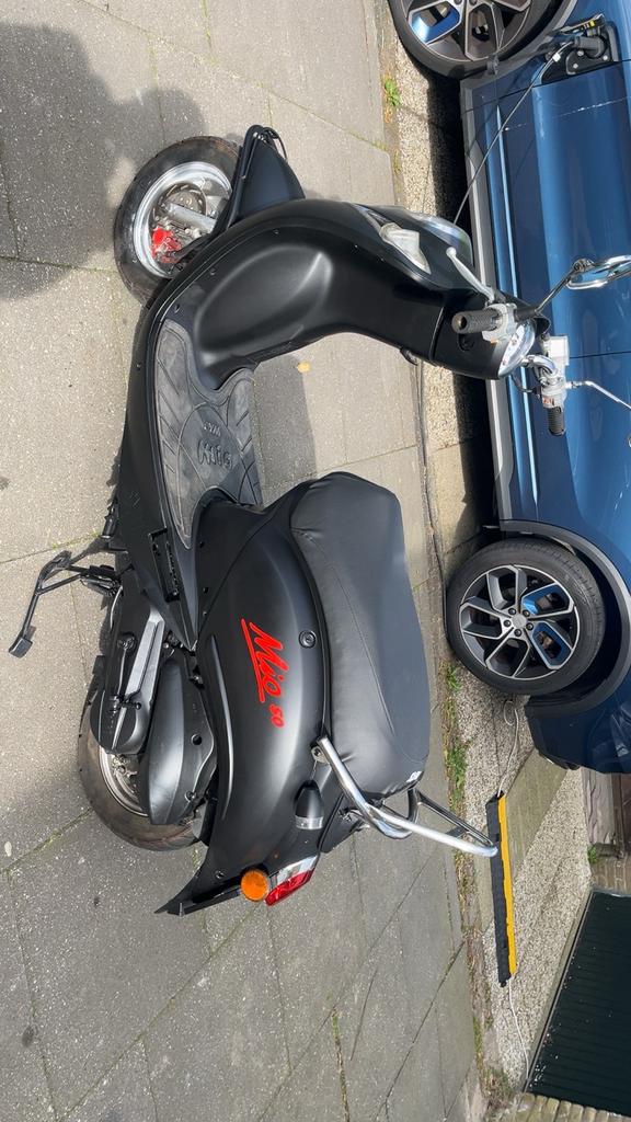 Sym Mio 50 - Zwart, Fietsen en Brommers, Scooters | SYM, Mio, Gebruikt, Maximaal 45 km/u, Ophalen of Verzenden