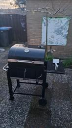 Zwarte houtskool barbecue met vuur regeling,deksel en wielen, Ophalen, Gebruikt