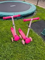 Twee roze stepjes voor tweeling!, Ophalen