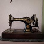 Antieke singer naaimachine, Ophalen