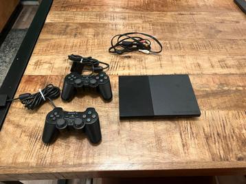 PlayStation 2 Slim + 2 Controllers beschikbaar voor biedingen