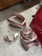 Roze goude kappenset, Ophalen