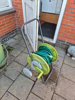 Tuinslang haspel, Ophalen, Gebruikt, Tuinslang