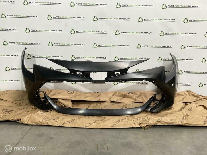 Voorbumper Toyota Corolla E210 NIEUW ORIGNEEL 52119-02P40, Auto-onderdelen, Carrosserie en Plaatwerk, Bumper, Toyota, Voor, Gebruikt