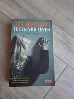 Thriller Teken van Leven van Liza Marklund, Ophalen of Verzenden, Gelezen, Nederland
