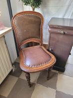 Antieke stoel met leer bekleed, Ophalen