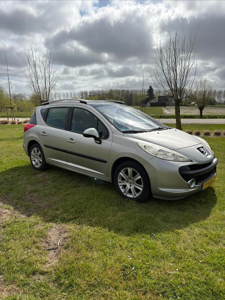 Peugeot 207 1.6 16V SW met trekhaak, elektrisch Panoramadak, Auto's, Peugeot, Particulier, Airbags, Elektrische ramen, Lichtmetalen velgen