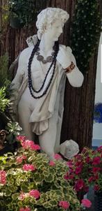 Mooi tuinbeeld van David met een hond., Ophalen