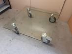 Stevige glazen design salon tafel met zwenkwielen, Ophalen, Gebruikt, 100 tot 150 cm, .