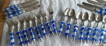 Bestek-set met het heft van Murano glas beschikbaar voor biedingen