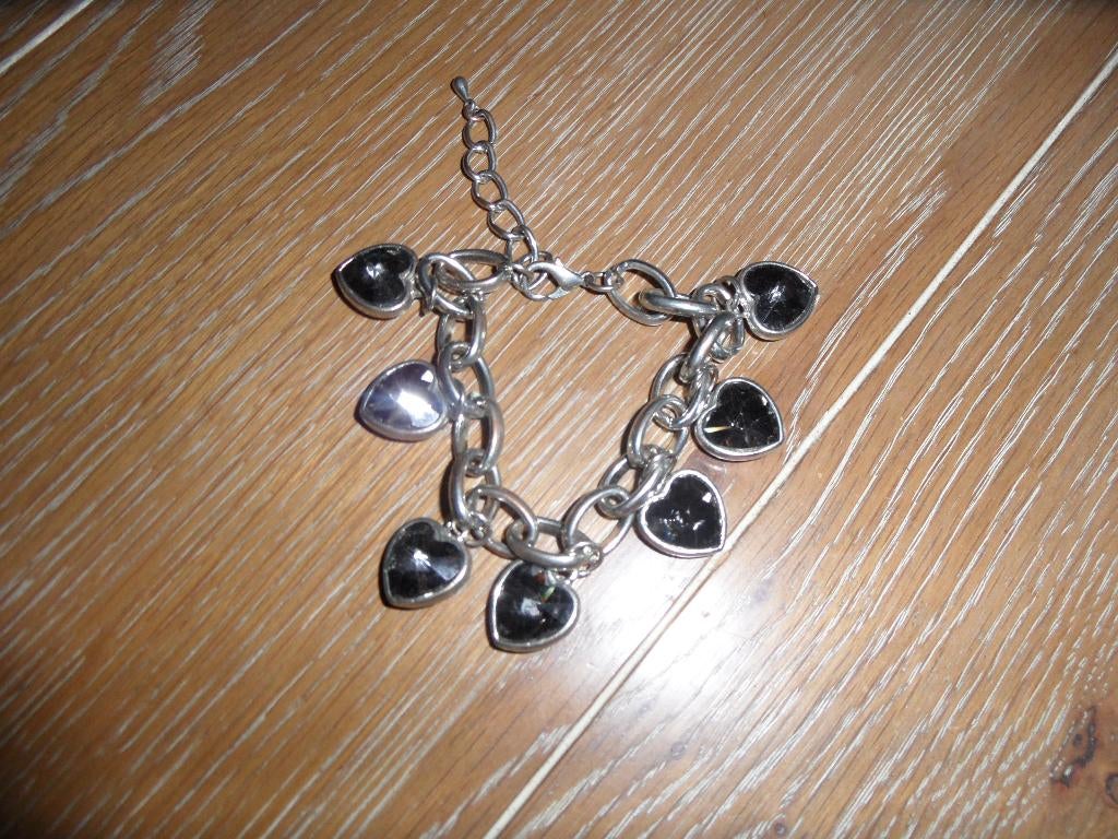 Schakelarmband met 7 blinkende hartjes, Overige materialen, Gebruikt, Ophalen of Verzenden, Met bedels of kralen