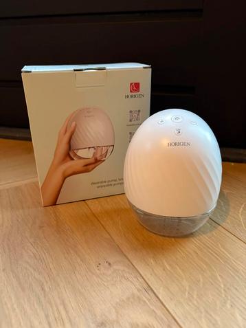 Horigen wearable handsfree borstkolf beschikbaar voor biedingen
