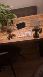 Nintendo Switch OLED + Games, Spelcomputers en Games, Spelcomputers | Nintendo Switch, Met games, Met 2 controllers, Zo goed als nieuw