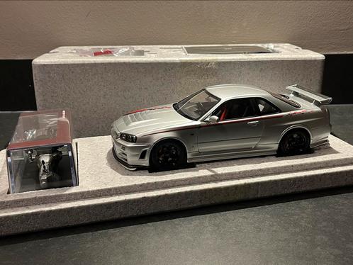 1:18 Motorhelix Nissan Skyline GT-R (R34) NISMO CRS zilver, Hobby en Vrije tijd, Modelauto's | 1:18, Nieuw, Auto, Overige merken