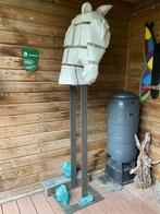 Houten paardenhoofd, Ophalen