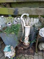 Antieke water pomp, Ophalen