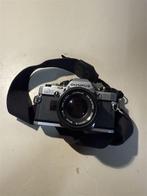 Vintage Olympus OM10 Spiegelreflex + Zuiko 50mm F/1.8 & Stra, Audio, Tv en Foto, Fotocamera's Analoog, Ophalen of Verzenden, Zo goed als nieuw