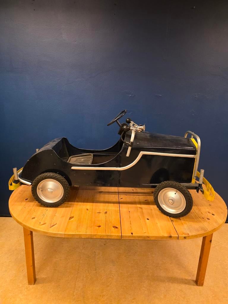 Metalen trapauto, Ophalen