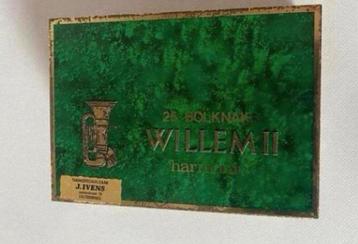 Groen rechthoekig blik van 25 Bolknaks Willem II harmonie. beschikbaar voor biedingen