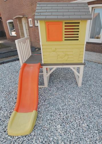 Te koop Smoby speelhuisje met glijbaan Nieuwstaat.... beschikbaar voor biedingen