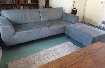 Mooi blauw 3 zits bankstel met apart voet/zitbankje