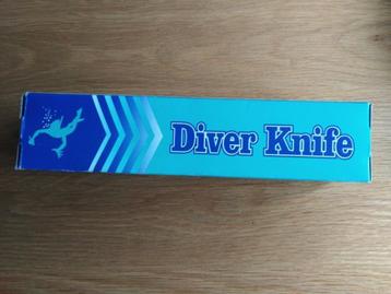 Te koop nieuw duikmes incl. gele houder voor aan been. beschikbaar voor biedingen