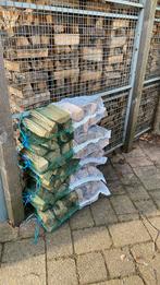 Droog eiken haardhout ca. 14 kilo per net, Tuin en Terras, Haardhout, Ophalen of Verzenden