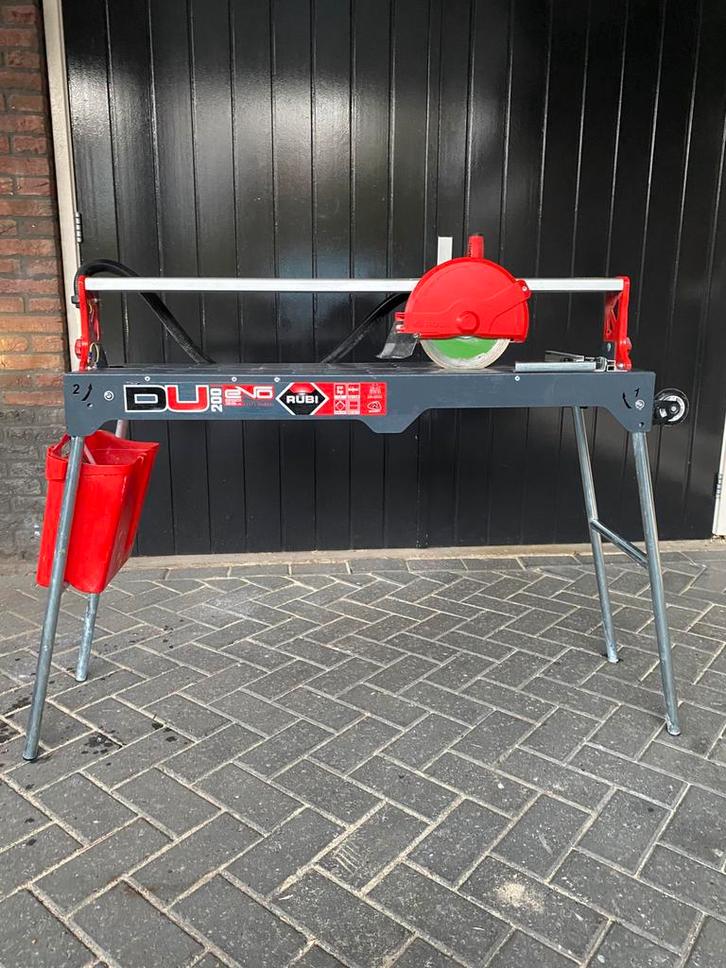 Rubi DU 200 Evo 850 Tegelzaagmachine - tegelsnijder, Doe-het-zelf en Verbouw, Gereedschap | Zaagmachines, Zo goed als nieuw, 600 tot 1200 watt
