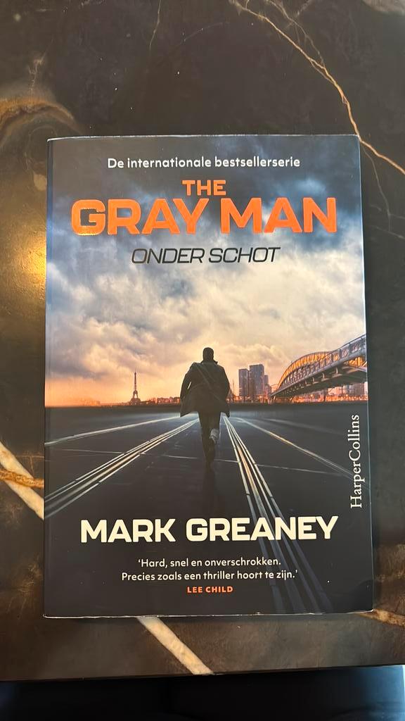 Mark Greaney - The Gray Man: Onder schot, Boeken, Thrillers, Zo goed als nieuw, Nederland, Ophalen of Verzenden