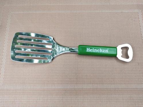 Oude spartel en tegelijk flesopener.  Van het merk Heineken, Verzamelen, Biermerken, Flesopener, Heineken, Ophalen of Verzenden