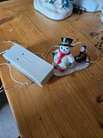 Sneeuwpop verlicht lemax, Ophalen