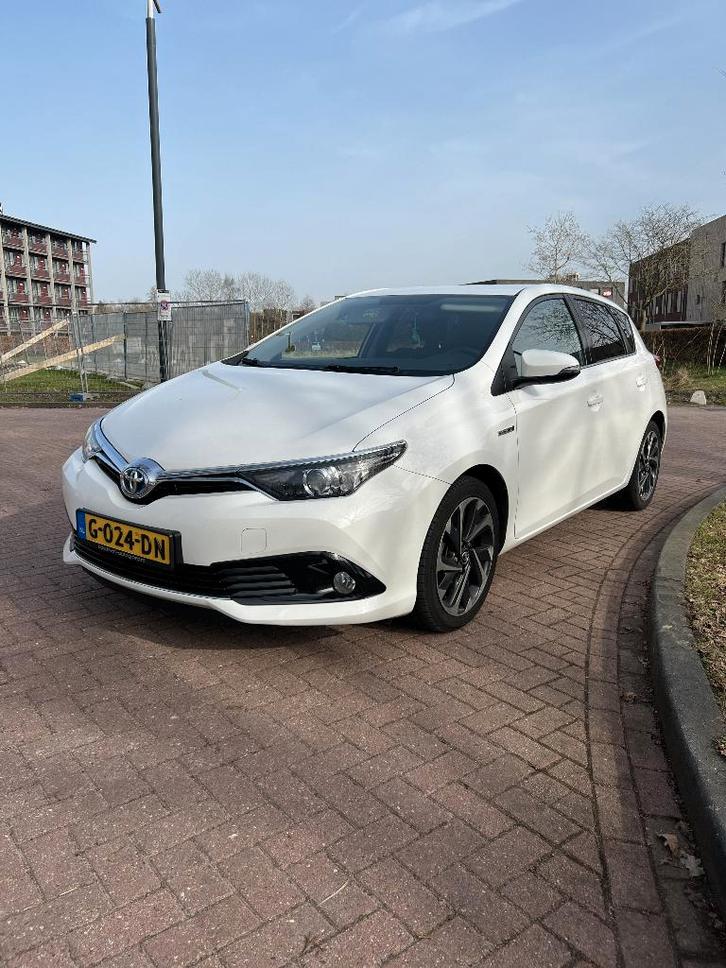 Toyota Auris 1.8 Hybrid 5DR CVT 2016 Wit, Auto's, Toyota, Particulier, Auris, Hybride Elektrisch/Benzine, Volledig hybride, A