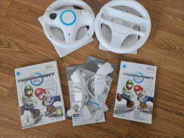 Wii mariokart + 2 wielen + 2 nunchucks beschikbaar voor biedingen