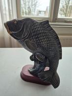 Schubkarper vis sculptuur, Ophalen