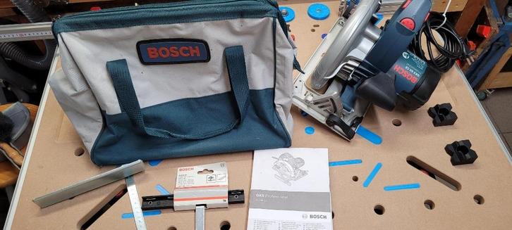 Cirkelzaag Bosch GKS 65 CE met geleiderail en tas z.g.a.n., Doe-het-zelf en Verbouw, Gereedschap | Zaagmachines, Zo goed als nieuw
