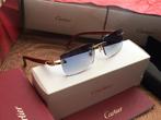 Cartier zonnebril hout goud, Ophalen