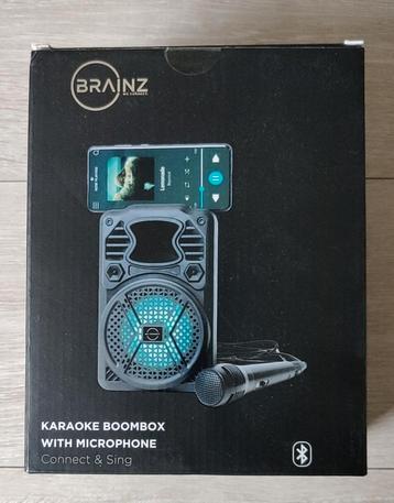 Portable karaoke boxje met microfoon beschikbaar voor biedingen