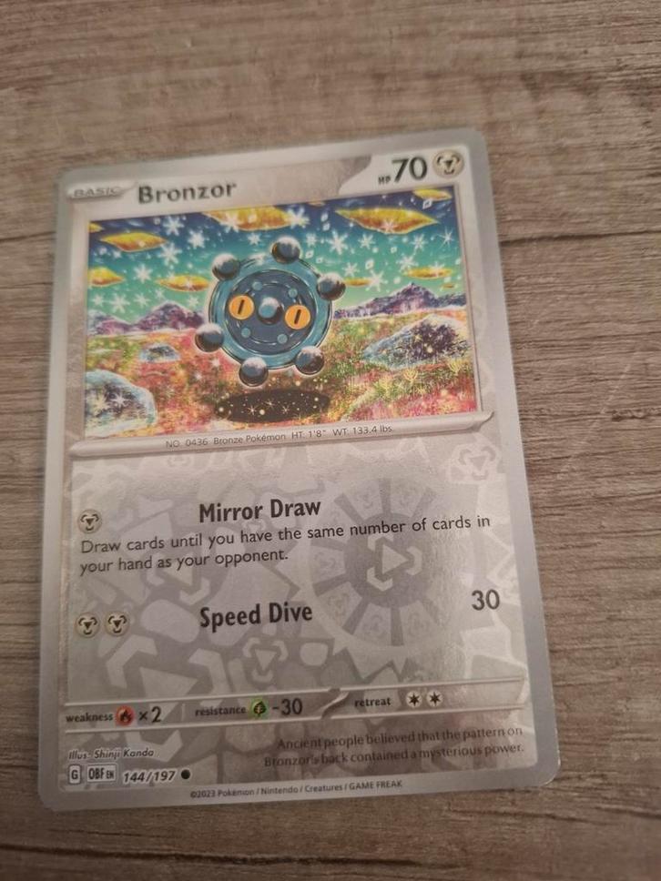 Bronzor - Obsidian Flames 144/197 - Foil Pokémonkaart, Hobby en Vrije tijd, Verzamelkaartspellen | Pokémon, Zo goed als nieuw