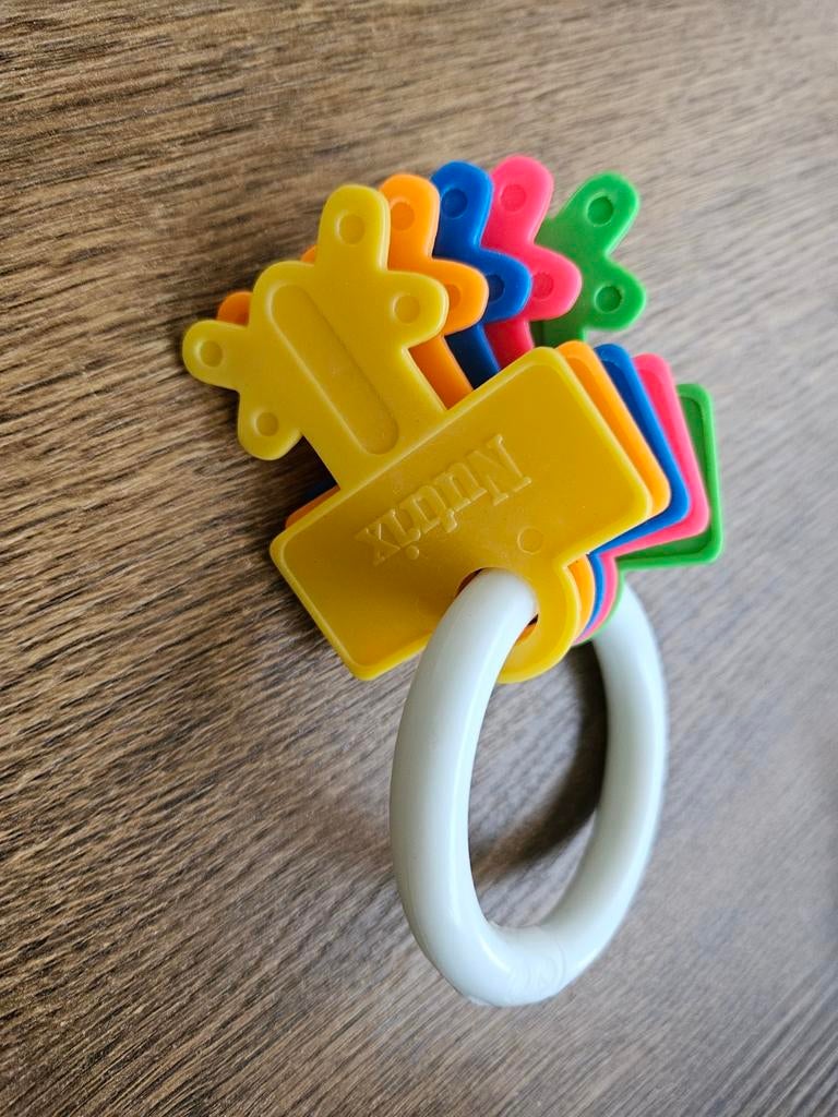 Kleurrijke Nutrix rammelaar met sleutels, Kinderen en Baby's, Speelgoed | Babyspeelgoed, Ophalen of Verzenden, Rammelaar